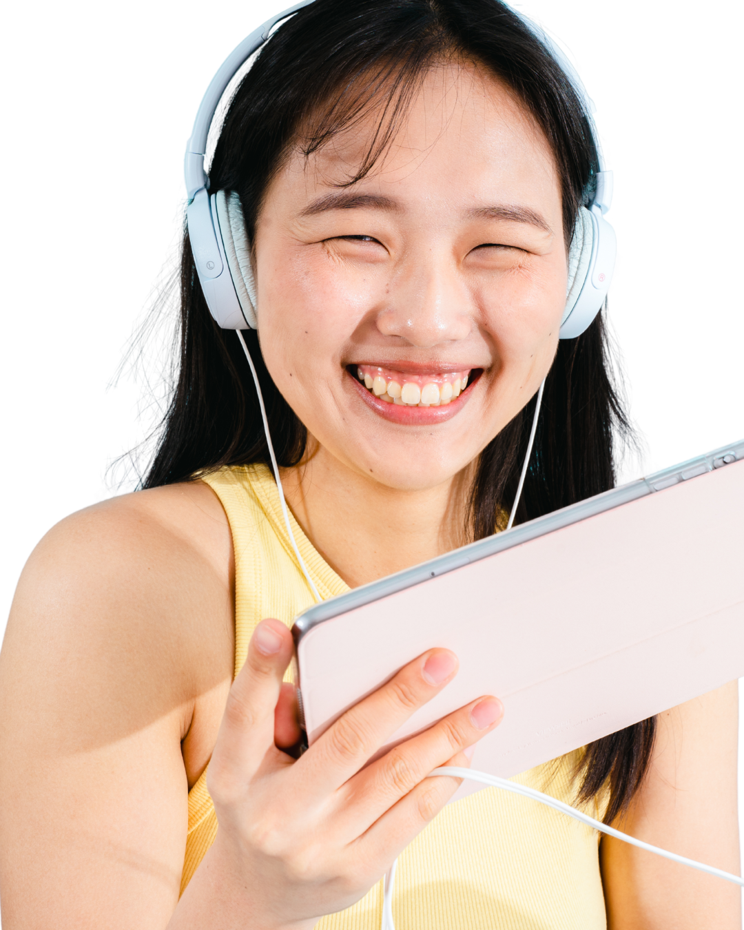 Smiling student with headphones holding a tablet
